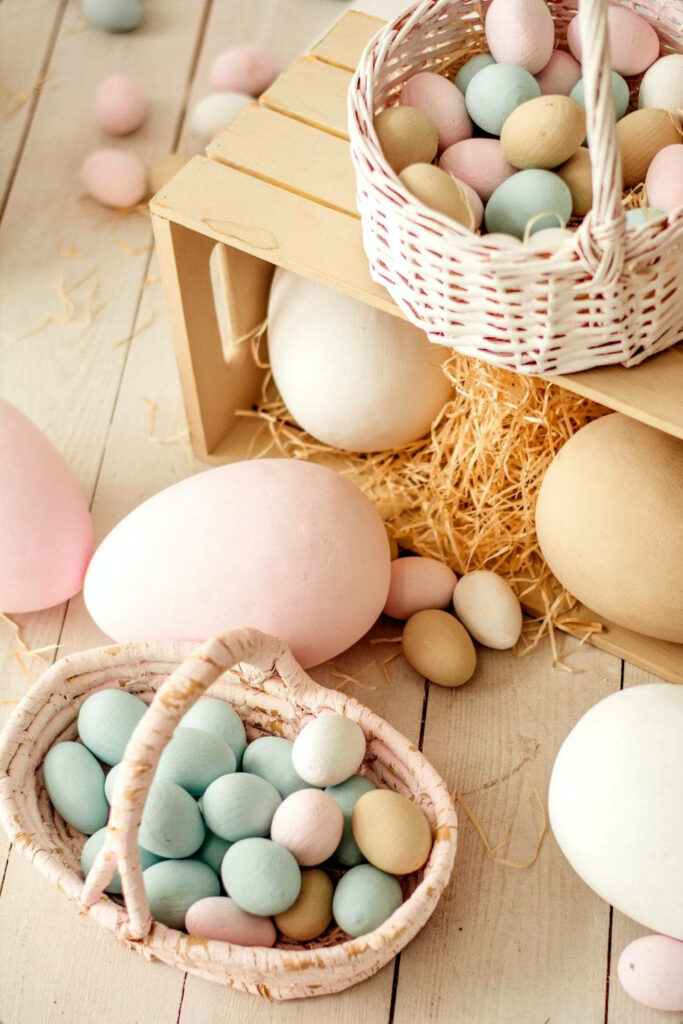 Charming Pastel Easter Egg Wallpaper on Rustic Wooden Surface