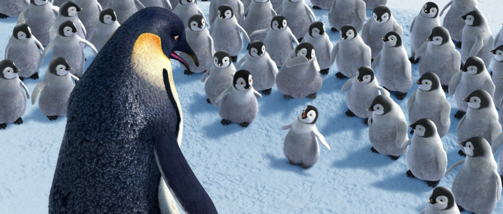 Charming Penguin Wallpaper: Heartwarming Scene with Adorable Chicks