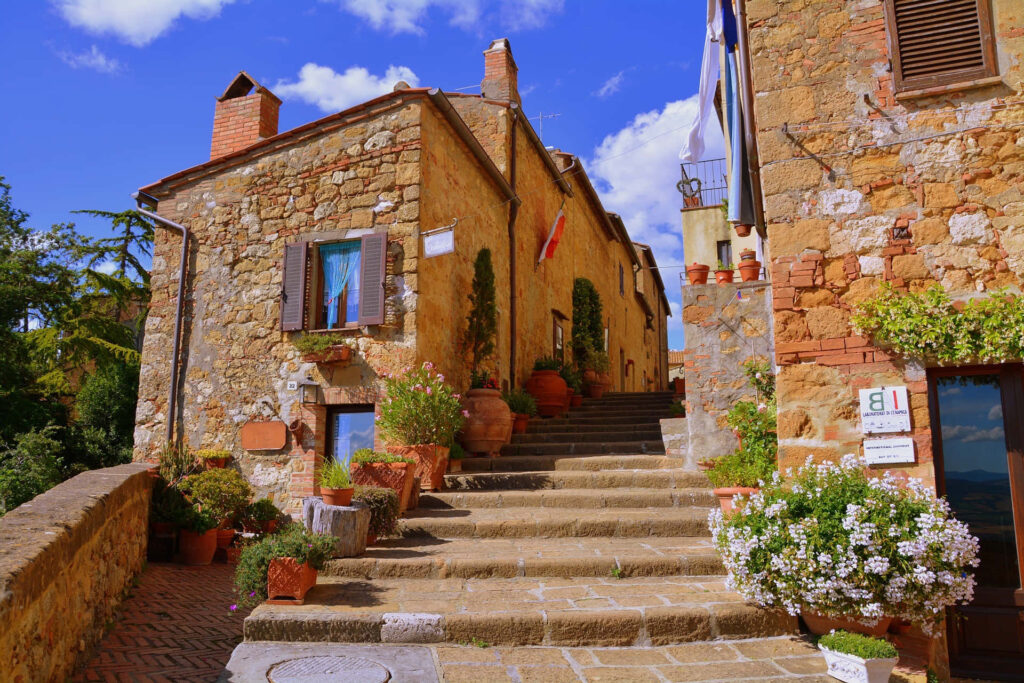 Rustic Stone Staircase Wallpaper with Charming Pienza Houses & Flowers