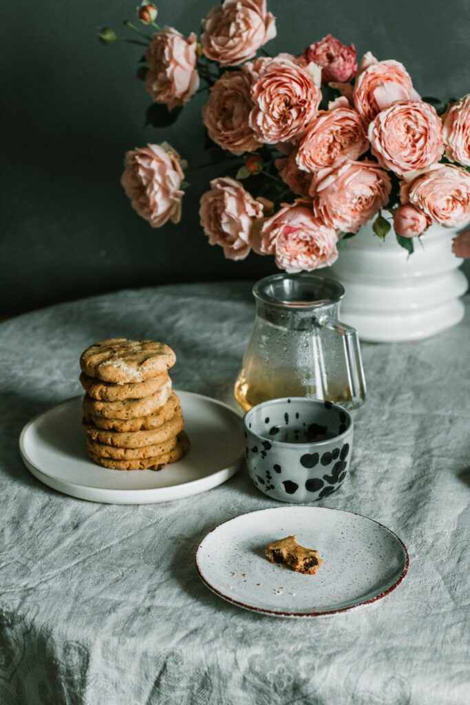 Charming Pink Flower Wallpaper with Rustic Cookies and Cozy Ambiance
