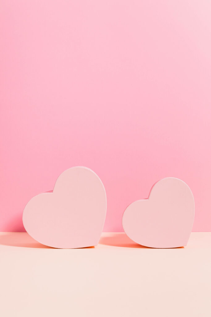 Romantic Minimalist Wallpaper: Pastel Pink Heart Boxes on Soft Background