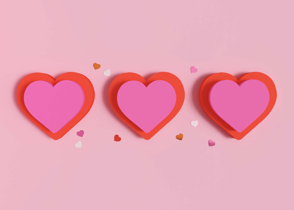 Charming Pink Heart Wallpaper with Colorful Accents on Soft Background