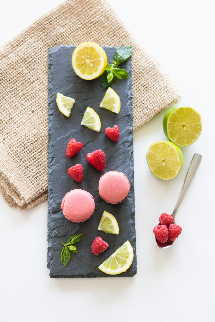 Charming Wallpaper: Pink Macarons & Fresh Berries on Slate Platter