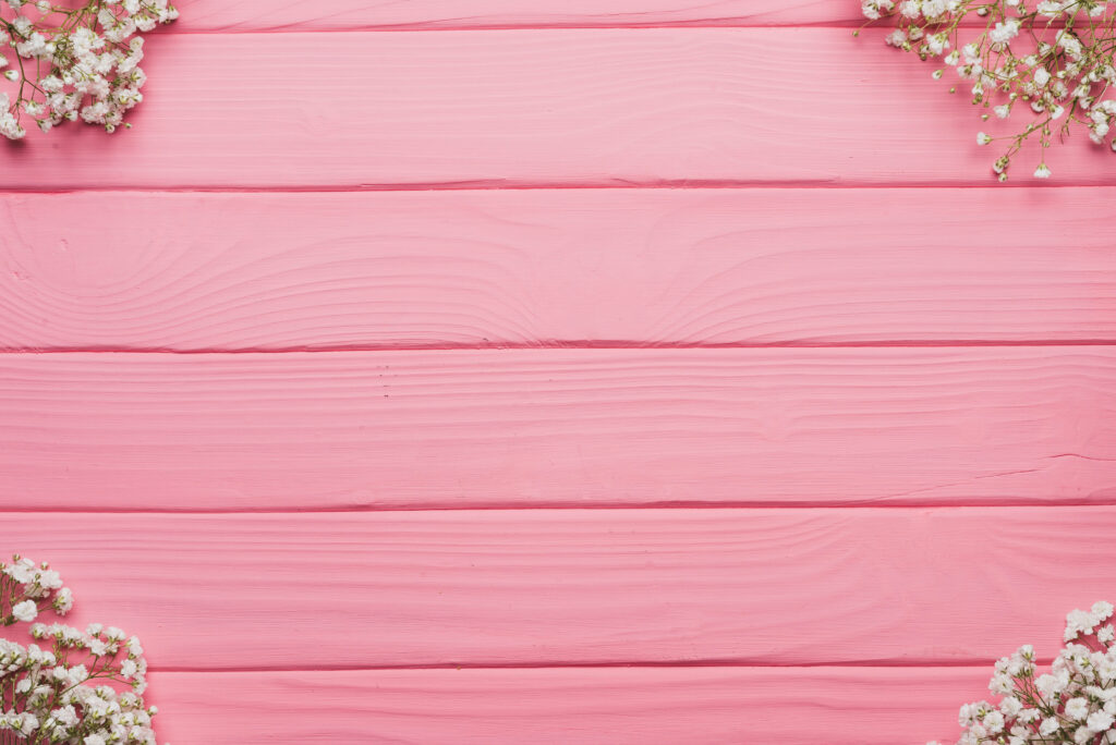 Charming floral wallpaper with vibrant pink wooden planks and white babys breath flowers