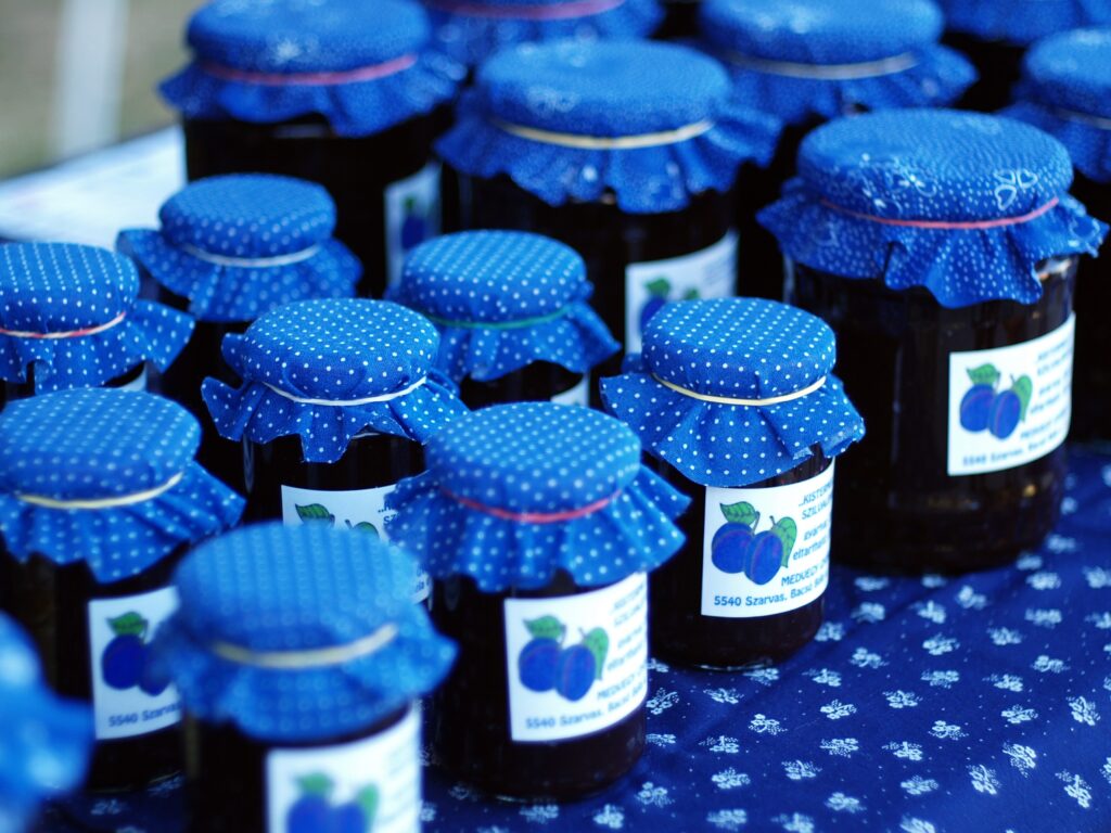 Charming Blue Polka-Dotted Jars of Plum Jam: Rustic Wallpaper Display