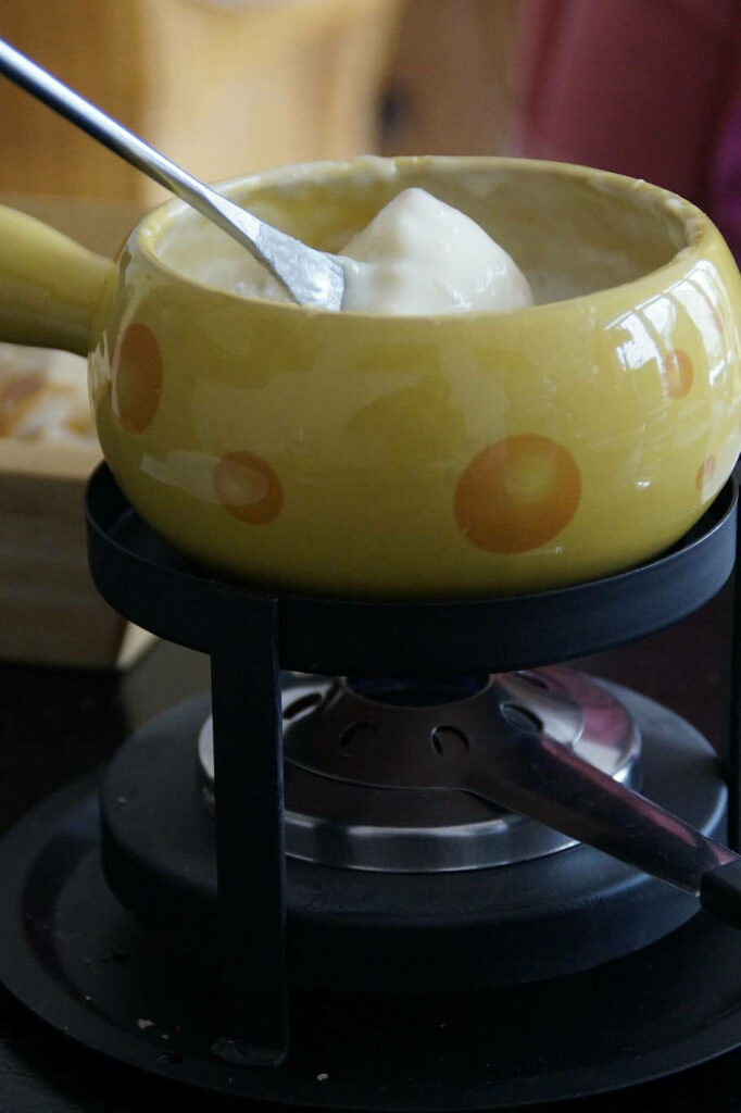 Charming Yellow Fondue Pot Wallpaper: Cute & Creamy Cheese Design