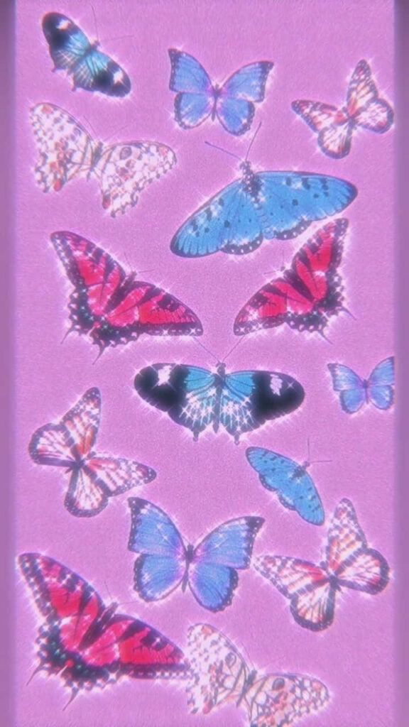 Charming Purple Butterfly Wallpaper on Soft Pink Background