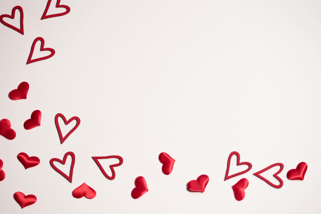 Charming Red Heart Wallpaper: Love-Filled Design on White Background