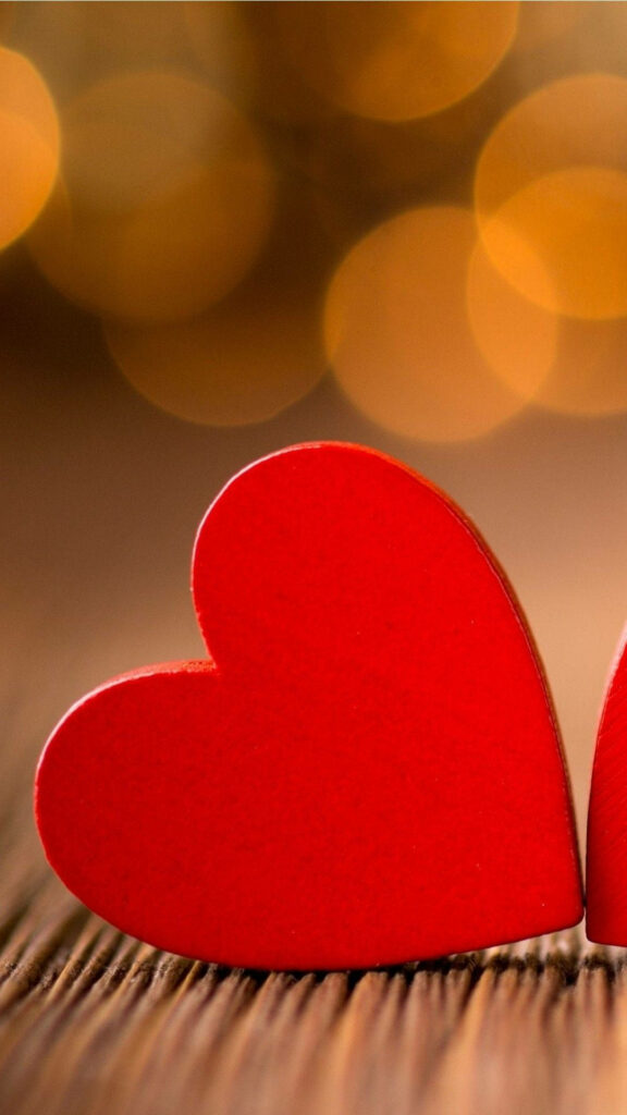 Charming Red Hearts Wallpaper on Wood with Golden Bokeh for iPhone