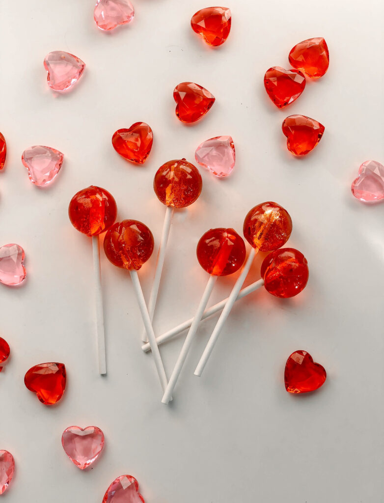 Charming Red Lollipops & Heart Candies Wallpaper Background