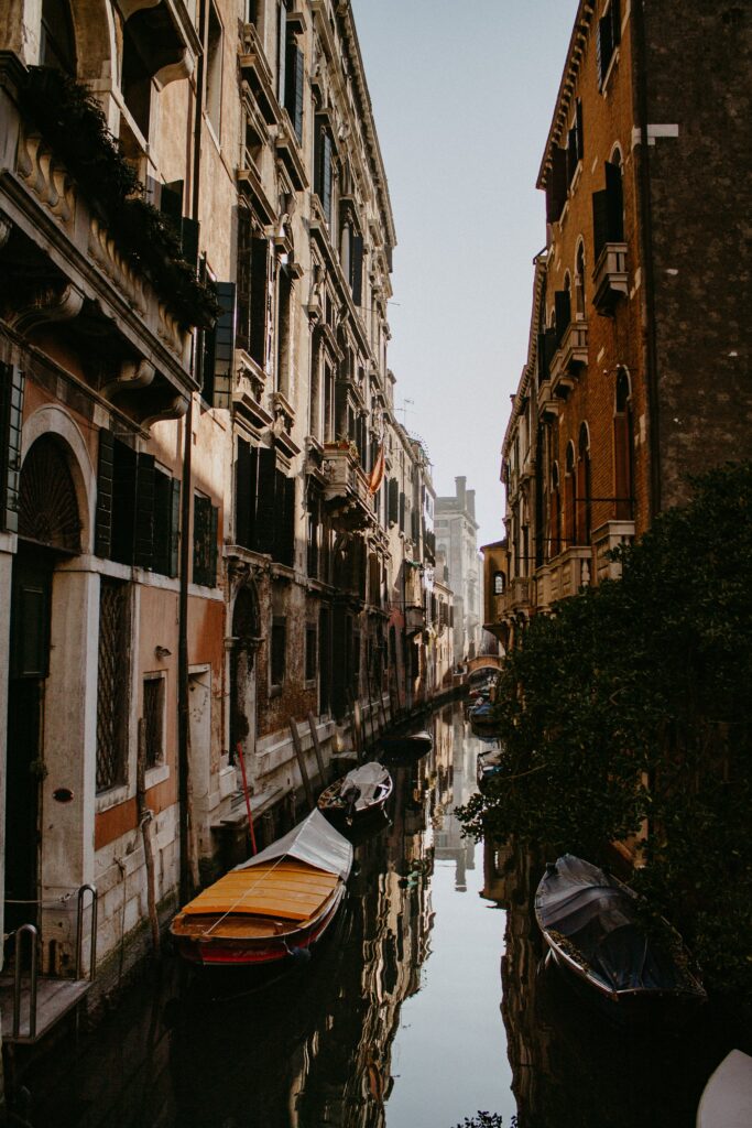 Charming Riverside Street Wallpaper: Serene Urban Waterway Scene