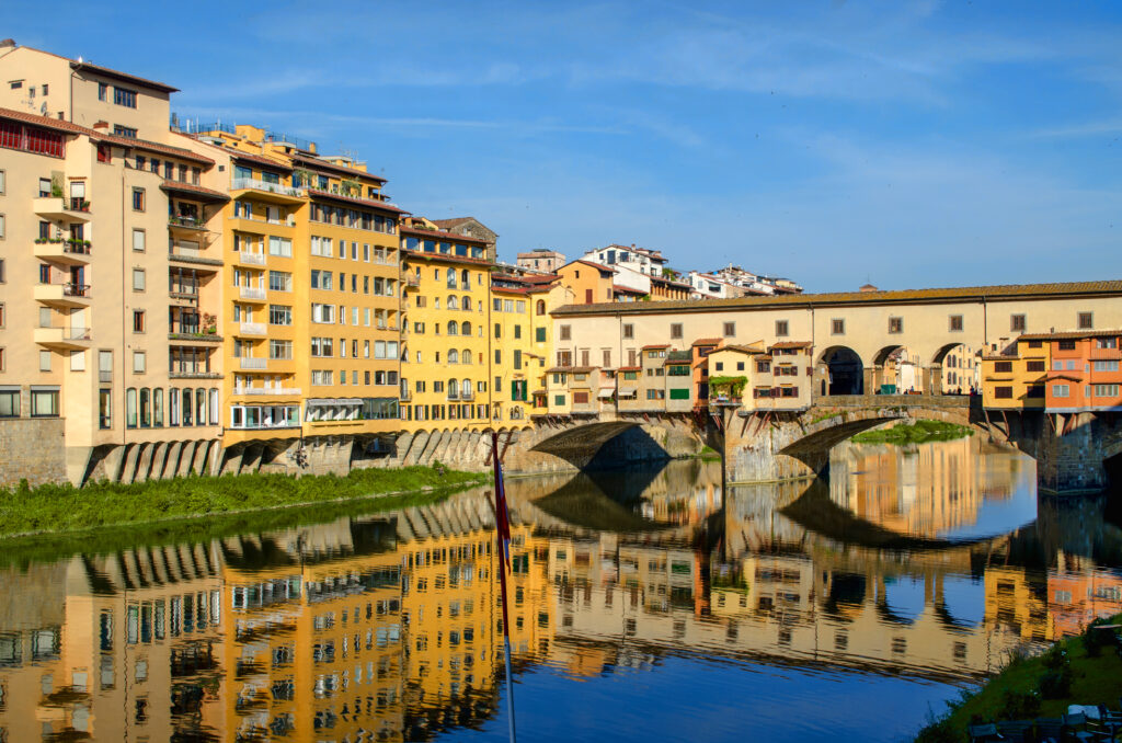 Charming Riverside Wallpaper: Historic Buildings & Elegant Bridge Reflection
