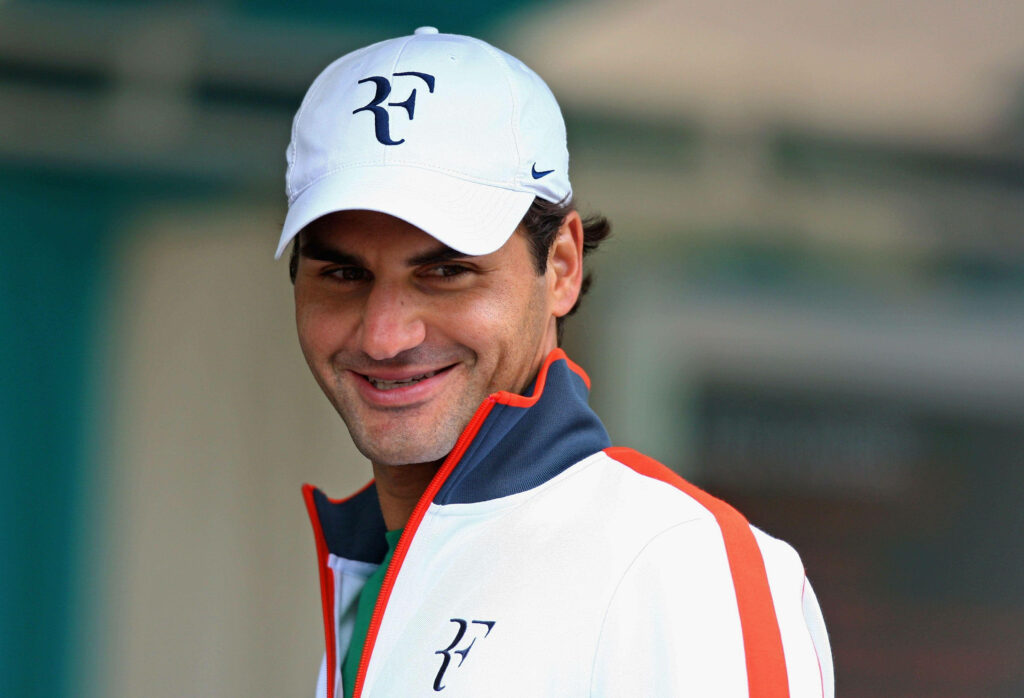 Roger Federer in Nike: Stylish Cap & Jacket Wallpaper Background
