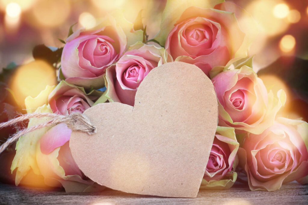 Charming Rustic Heart Tag with Pink Roses Wallpaper Background
