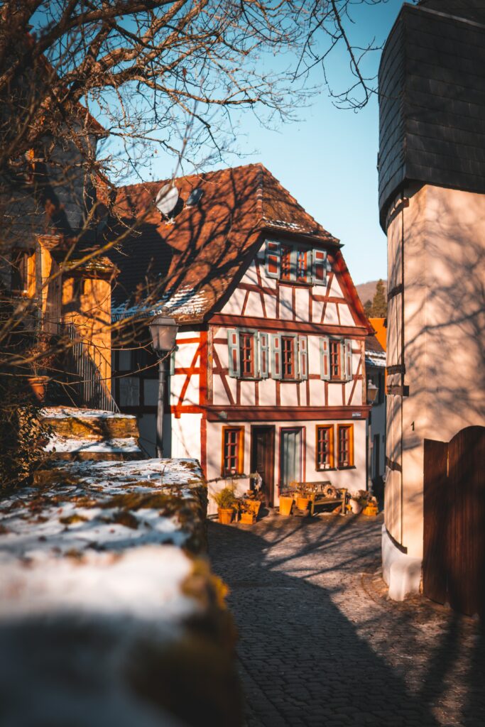 Charming Rustic House Wallpaper: Cozy Half-Timbered Architecture