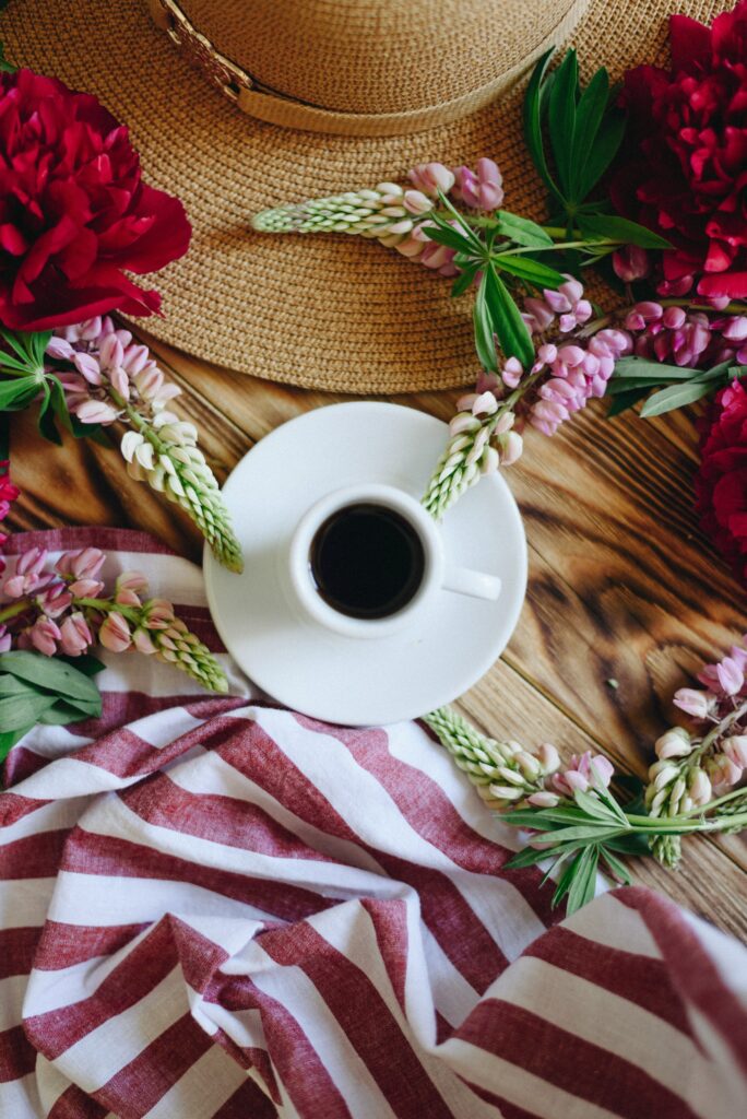 Charming Wallpaper: White Coffee Cup & Flowers on Rustic Table