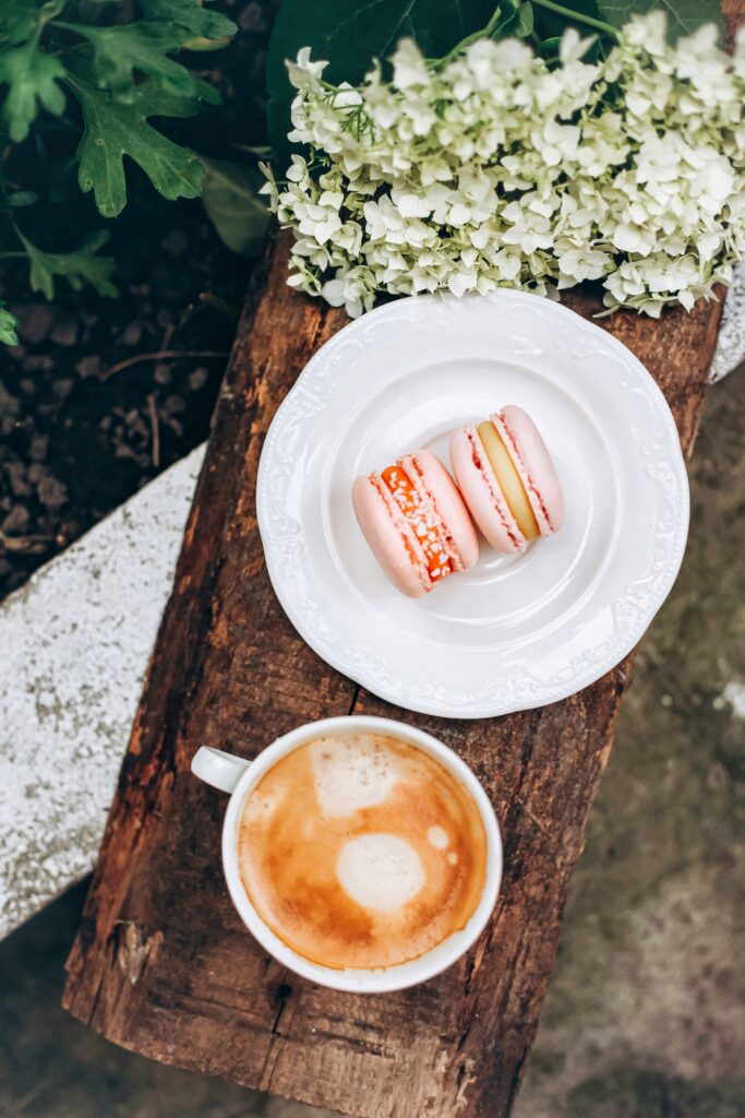 Rustic Wallpaper: Colorful Macarons & Coffee on Wooden Surface