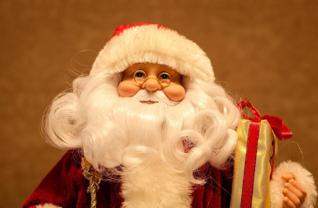 Charming Santa Claus Wallpaper: Festive Holiday Cheer and Gifts
