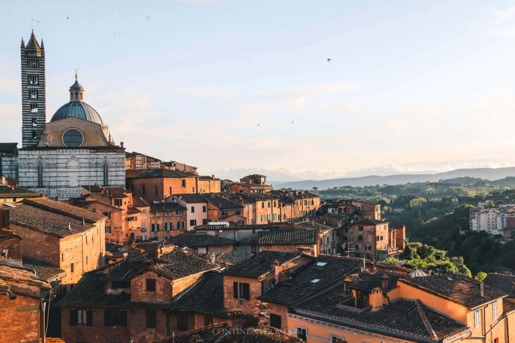 Charming Siena Wallpaper: Historic Houses & Scenic Countryside View