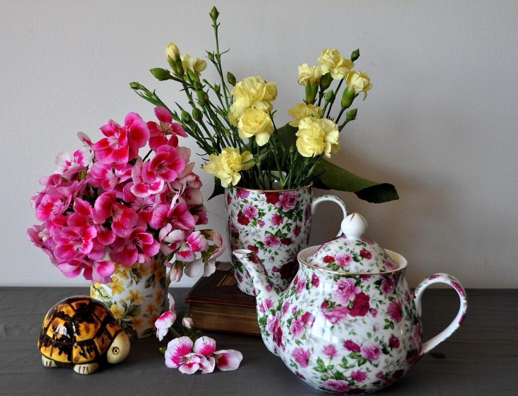 Charming Floral Still Life: Pink & Yellow Flowers with Teapot Wallpaper