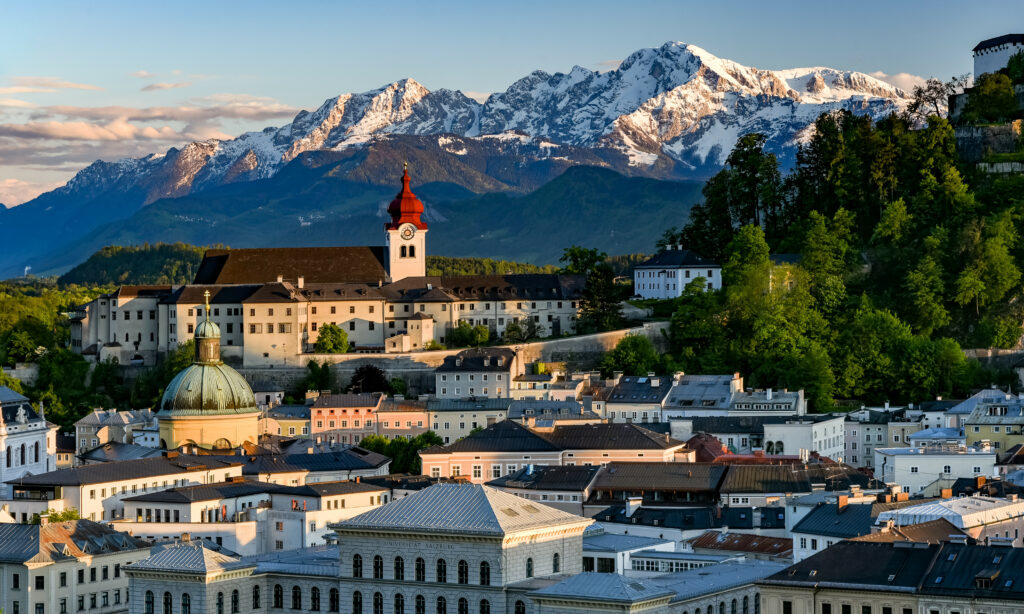 Charming Town Wallpaper: Serene Architecture & Snow-Capped Mountains