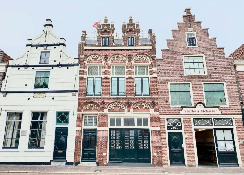 Traditional Dutch architecture in Alkmaar featuring ornate facades and gabled roofs wallpaper