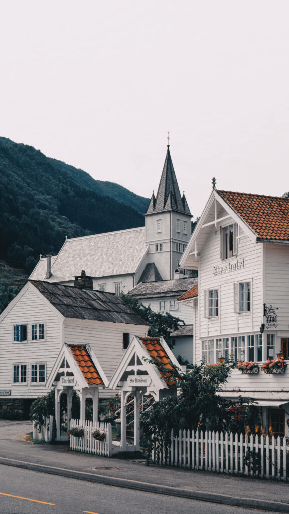 Charming Utne Hotel in Norway - Serene Wooden Village & Mountain Wallpaper