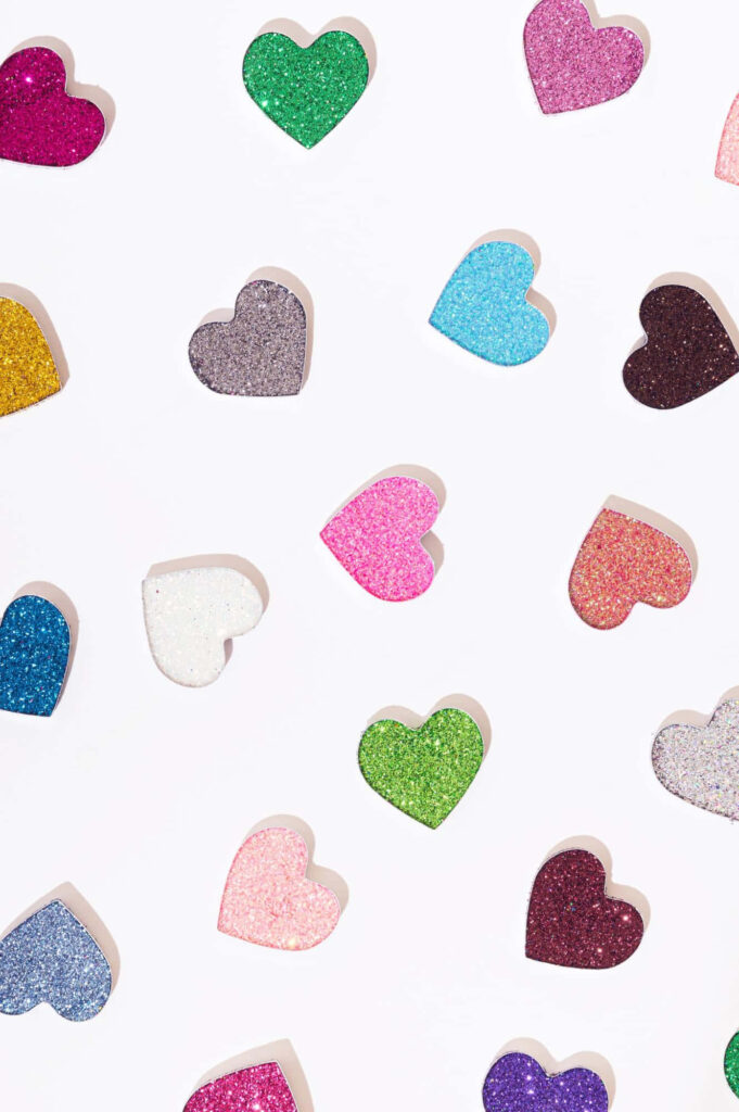 Charming Valentine's Day Wallpaper: Glittery Heart Shapes on White