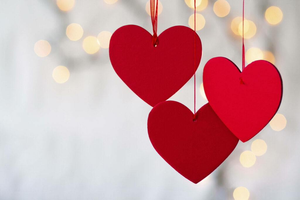 Romantic Valentine's Wallpaper: Red Hearts on Soft Bokeh Background