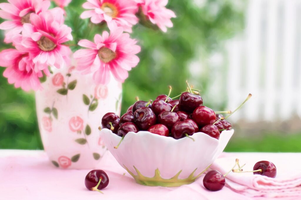 Charming Cherry Bowl Wallpaper: Cheerful Floral Table Setting