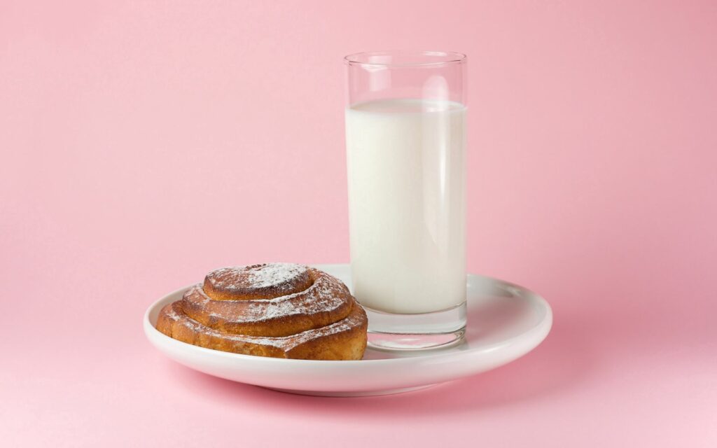Sweet Cinnamon Roll & Milk Wallpaper on Soft Pink Background