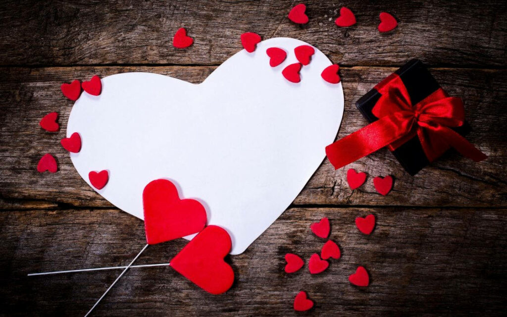 Charming Heart Wallpaper: White Heart & Red Petals on Wood