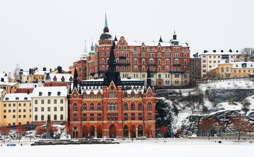 Charming Winter Cityscape Wallpaper: Snowy Historic Buildings