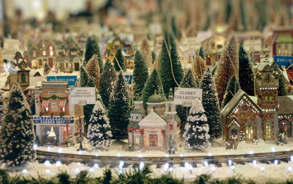 Cozy Winter Village Wallpaper: Snowy Houses & Festive Lights Background