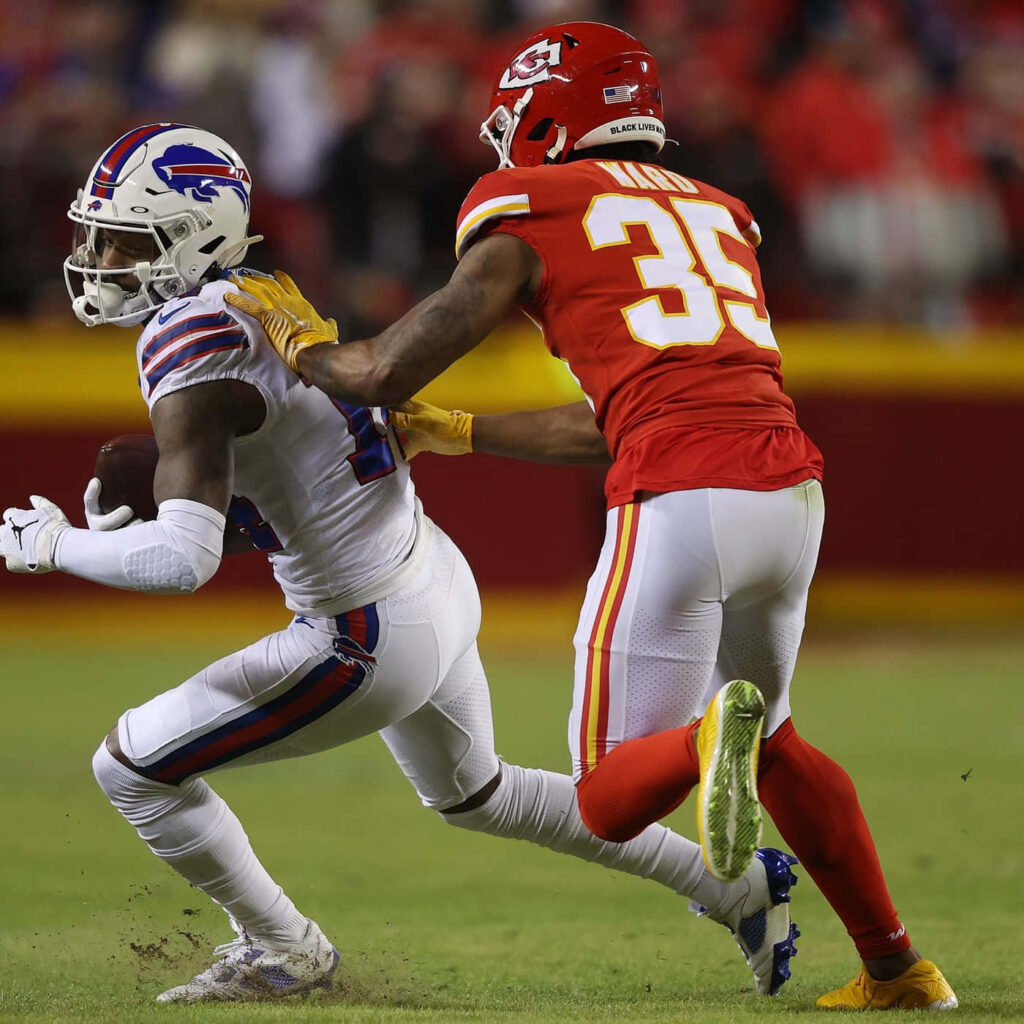 Charvarius Ward intense NFL defensive play vibrant team colors dynamic football game wallpaper