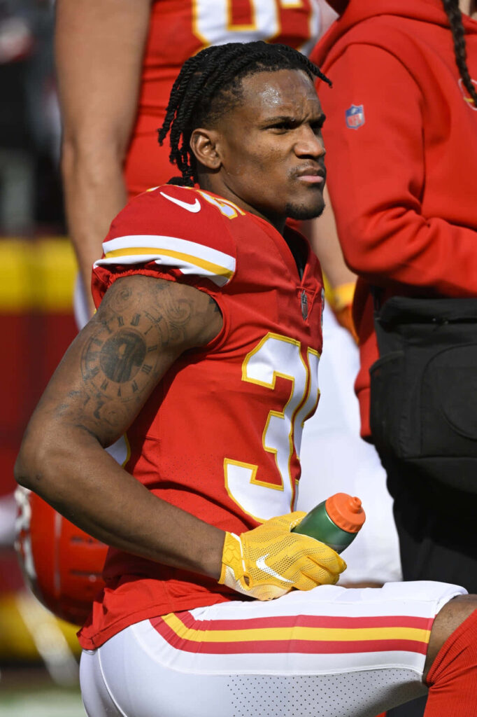 Charvarius Ward on Kansas City Chiefs sideline wearing red gold uniform showing game day intensity Wallpaper