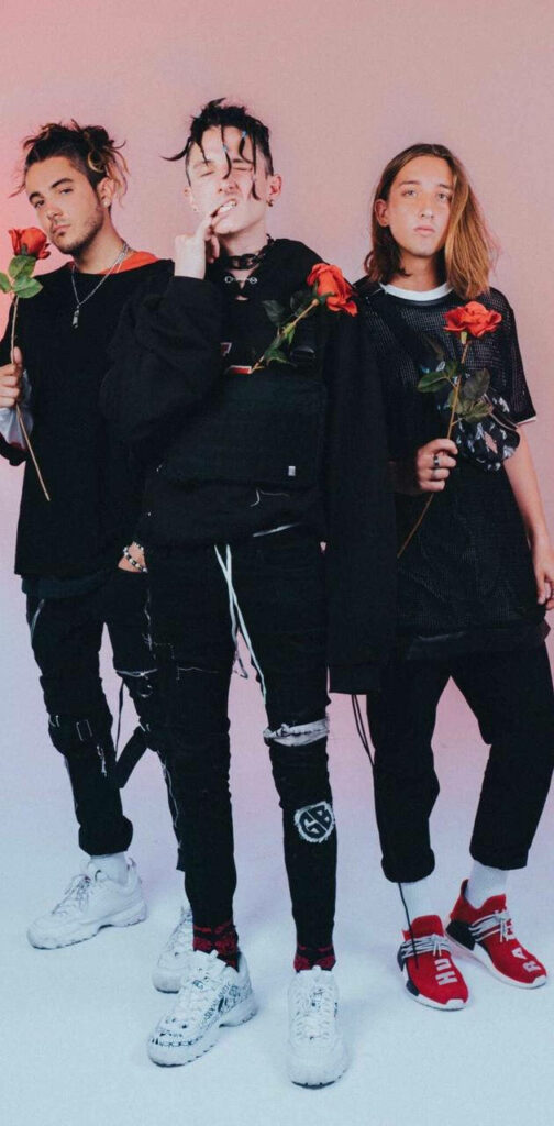 Chase Atlantic members Mitchel Cave Clinton Cave Christian Anthony holding roses edgy fashion wallpaper