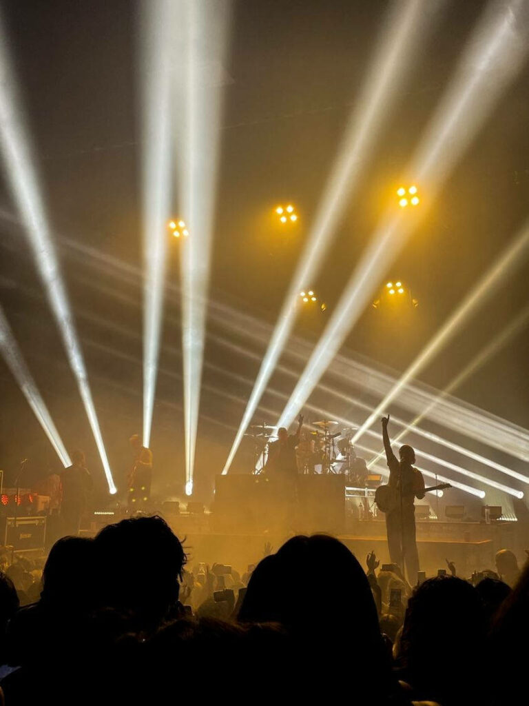 Chase Atlantic live concert vibrant wallpaper with Mitchel Cave and band dynamic stage lights