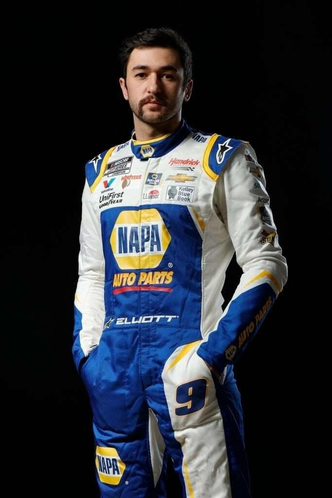 Chase Elliott in blue white NAPA Auto Parts racing suit with number 9 on dark background wallpaper