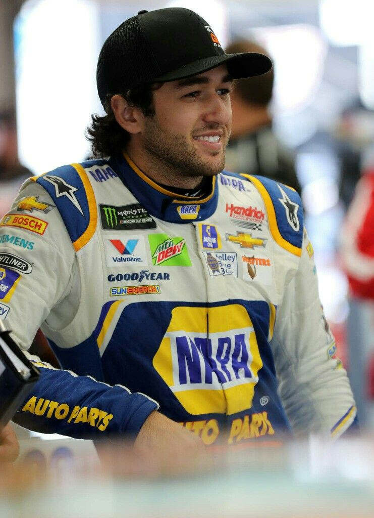 Chase Elliott NASCAR driver in blue yellow white racing suit confident professional wallpaper