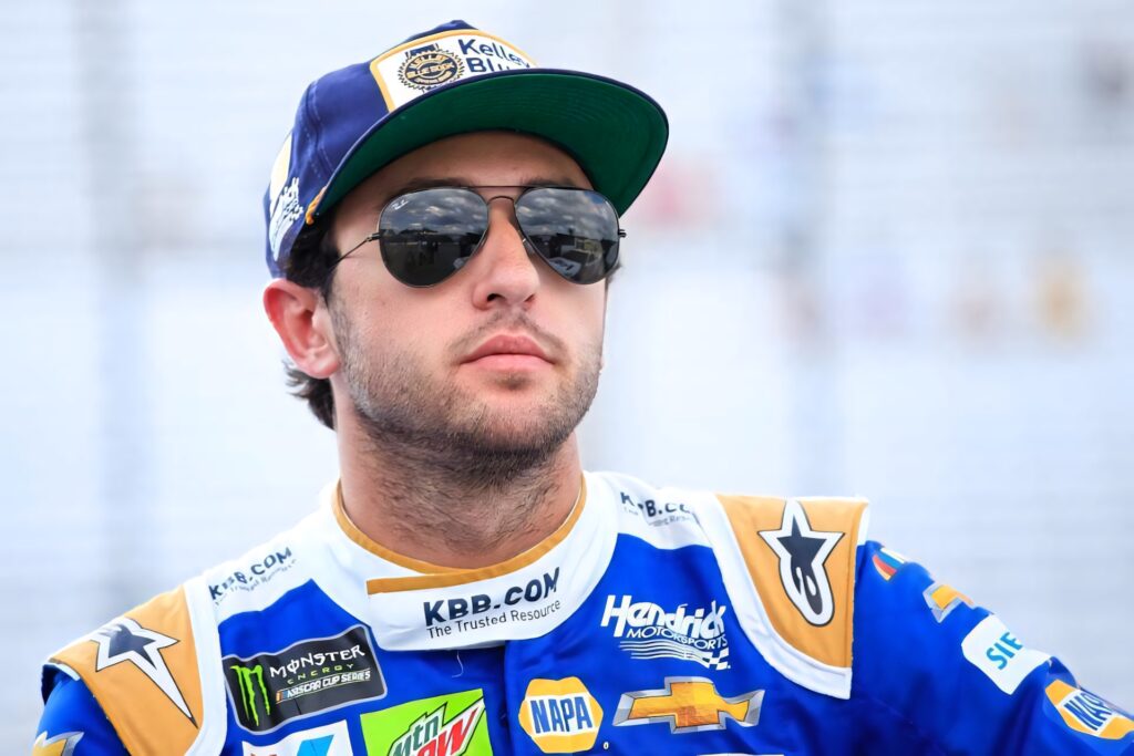Chase Elliott NASCAR driver in blue white racing suit reflective sunglasses team cap wallpaper