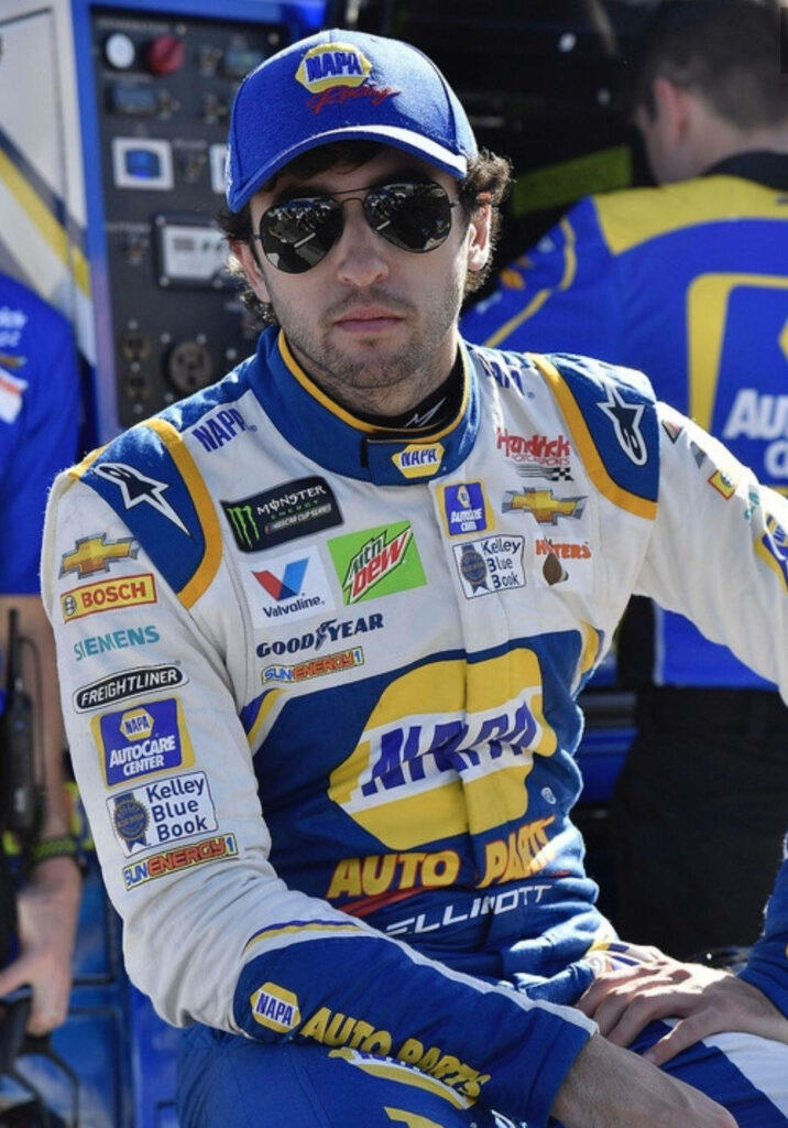 Chase Elliott in racing suit with NAPA logos vibrant NASCAR wallpaper background in blue yellow white