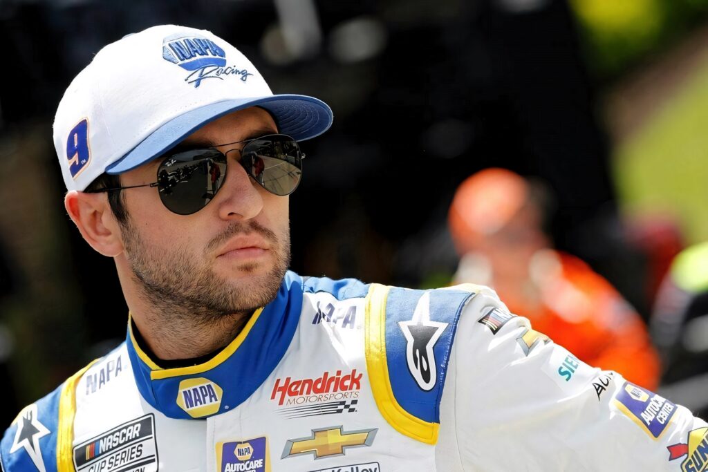Chase Elliott NASCAR wallpaper with blue yellow racing suit focused confident expression