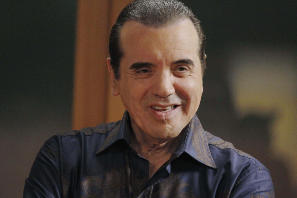 Chazz Palminteri close-up with confident smile slicked-back hair dark patterned shirt wallpaper