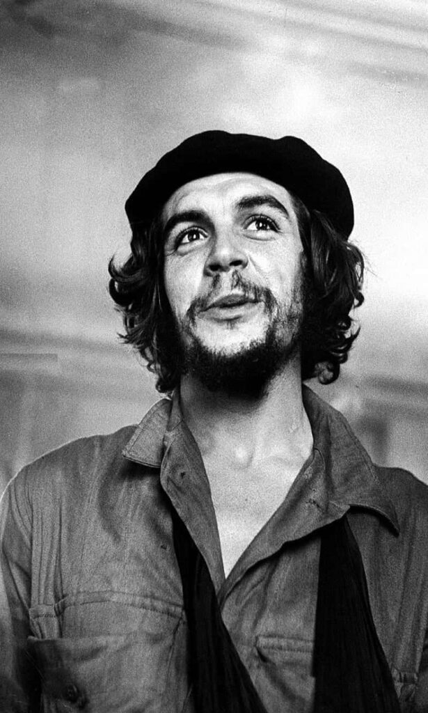 Che Guevara portrait wallpaper showing his determined expression and revolutionary spirit background