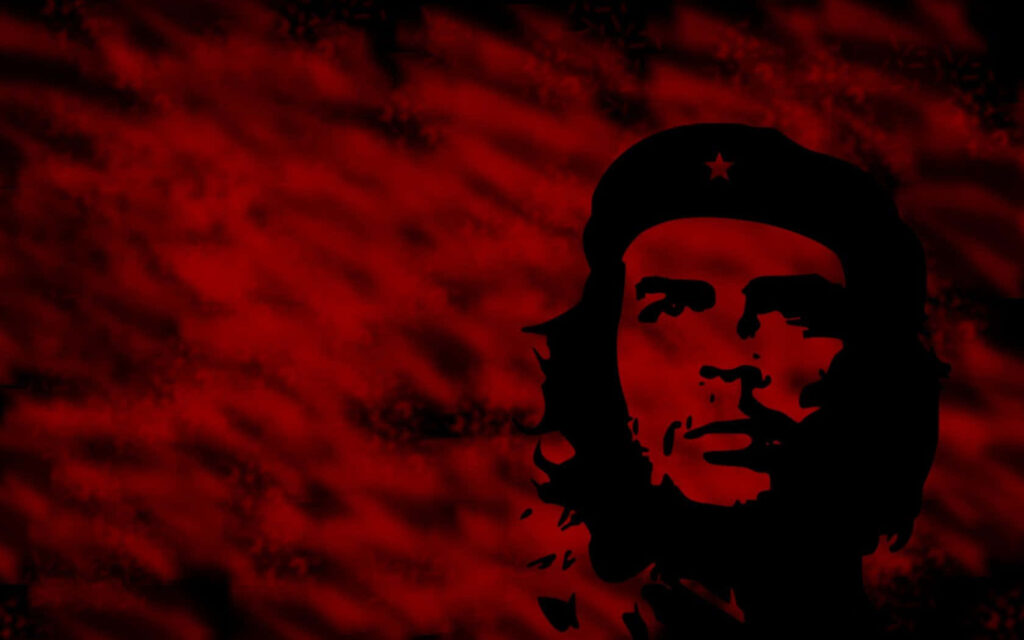 Che Guevara silhouette wallpaper on vivid red background symbolizing revolution legacy