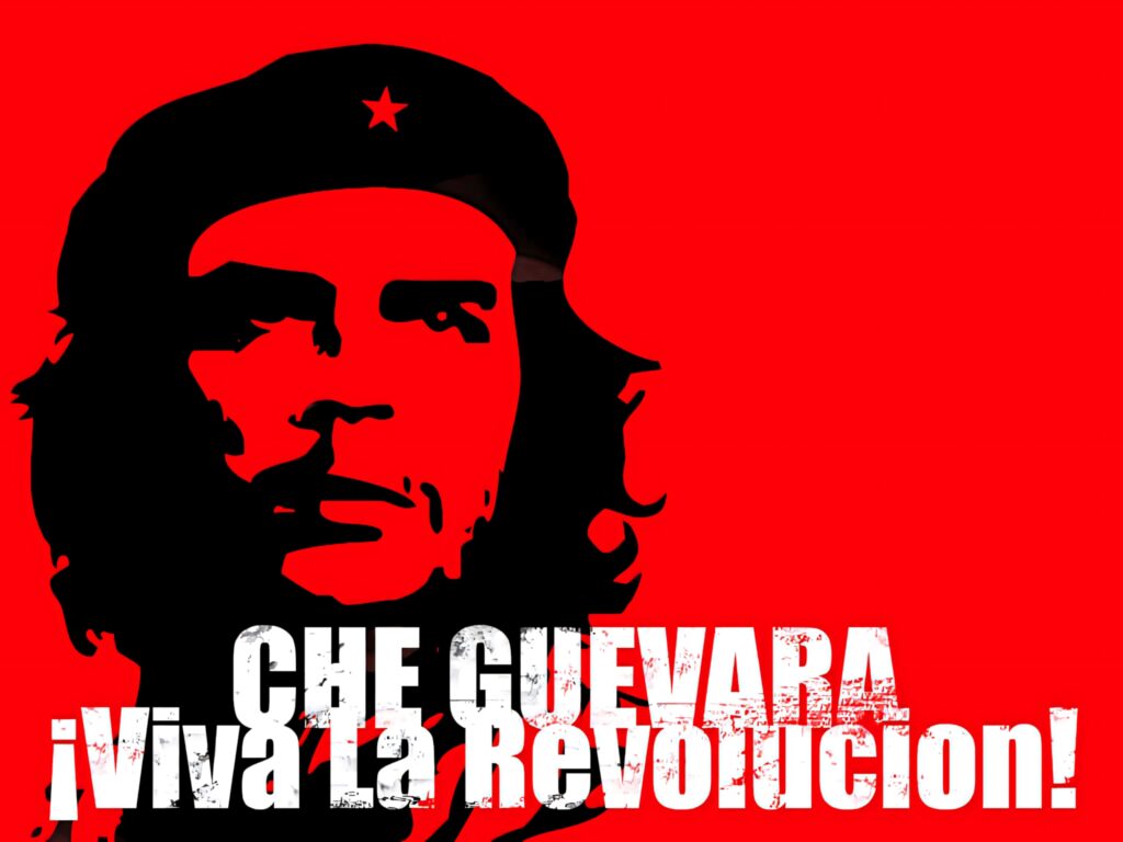 Che Guevara iconic black portrait on red background with Viva La Revolucion bold white text wallpaper