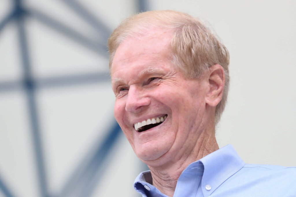 Cheerful Bill Nelson smiling brightly desktop wallpaper for positive uplifting screen background