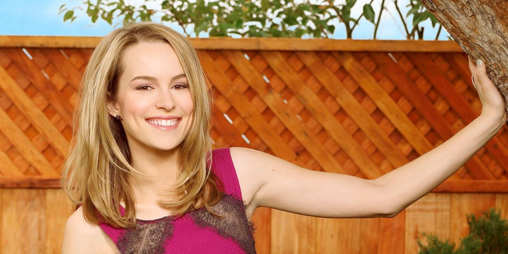 Bridgit Mendler radiant smile outdoor portrait sunny wooden fence Good Luck Charlie wallpaper