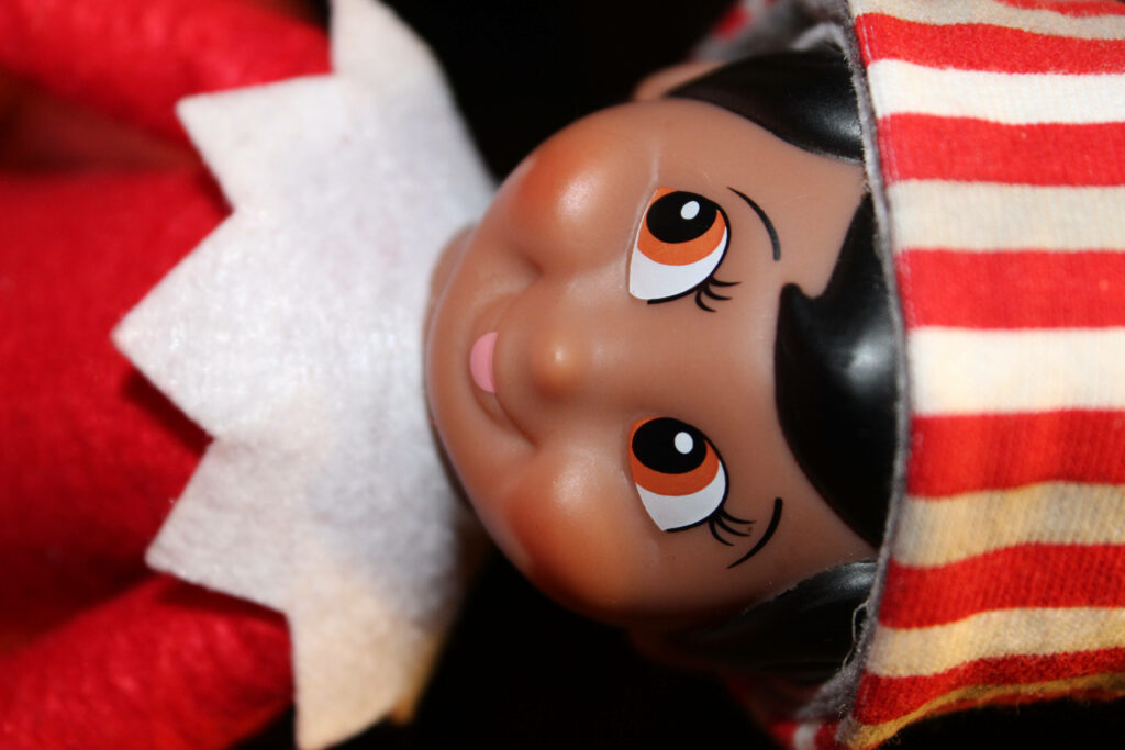 Cheerful Christmas Elf Figurine Wallpaper - Festive Holiday Spirit